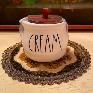 Rae Dunn CREAM ceramic creamer with wooden top with leather loop holder.